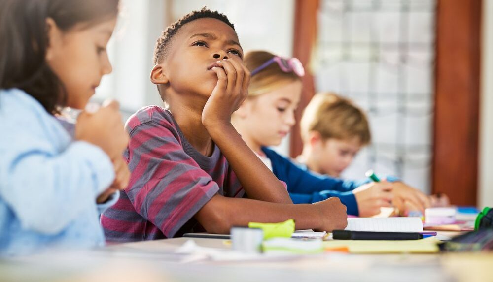 child with ADHD struggles concentrating in class