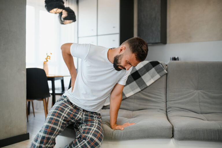 Delayed Injury After an Accident. Man experiencing back pain.